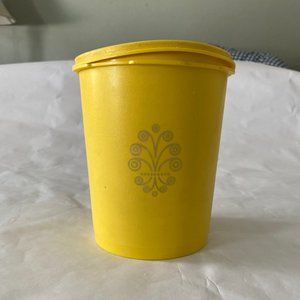 Vintage Tupperware canister yellow with sunburst lid
